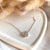 CL122 Collana rolò in argento con casina Family passante