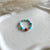 A025 Anello elasticizzato pepite mini e cubetti in aulite e rondella corallo