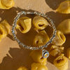 B131 Bracciale con pepite, rondelle e ciondolo Tortellino pendente