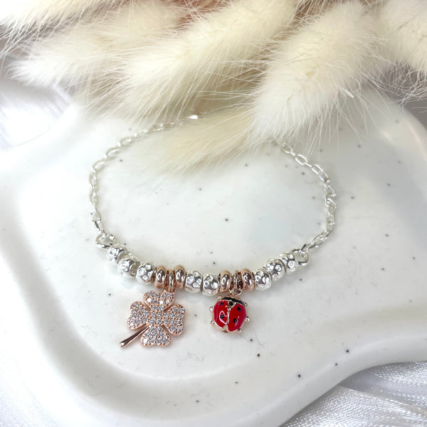 B158 Bracciale con granelli centrali e ciondoli a scelta (non inclusi nel prezzo)