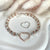 B125 Bracciale con pepite martellate medie e nodini rosati+ cuore vuoto grande centrale