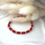 B0165 Bracciale con rondelle corallo e palline argento