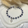 B0179 Bracciale argento rosario con rondelle tanzanite e perla di fiume pendente