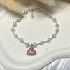 B0188 Bracciale rosario argento con perle di fiume e cuore smaltato