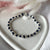 B138 Bracelet with knots (color of your choice) medium hammered nuggets and initial (of your choice)